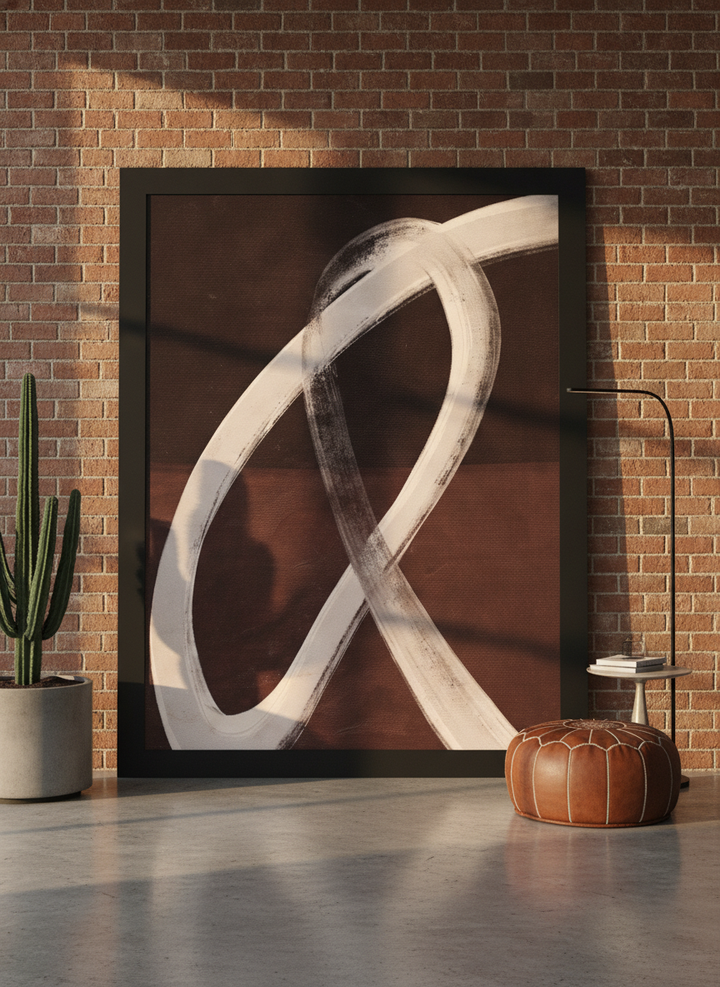 Oversized statement modern wall art print leaning against the wall in an industrial loft living room