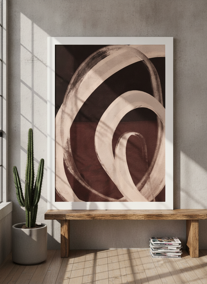 Modern wall art print standing on a bench in an industrial loft bedroom