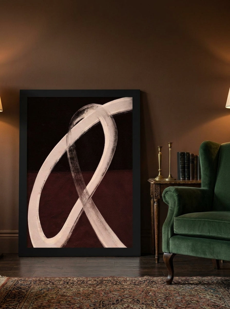Modern wall art print leaning against the wall in a moody home office