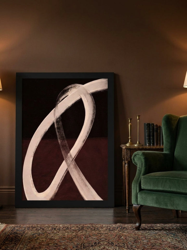 Modern wall art print leaning against the wall in a moody home office