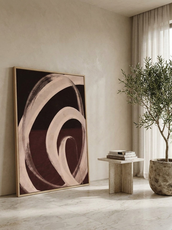 Oversized statement modern wall art print leaning against the wall in a luxe bedroom