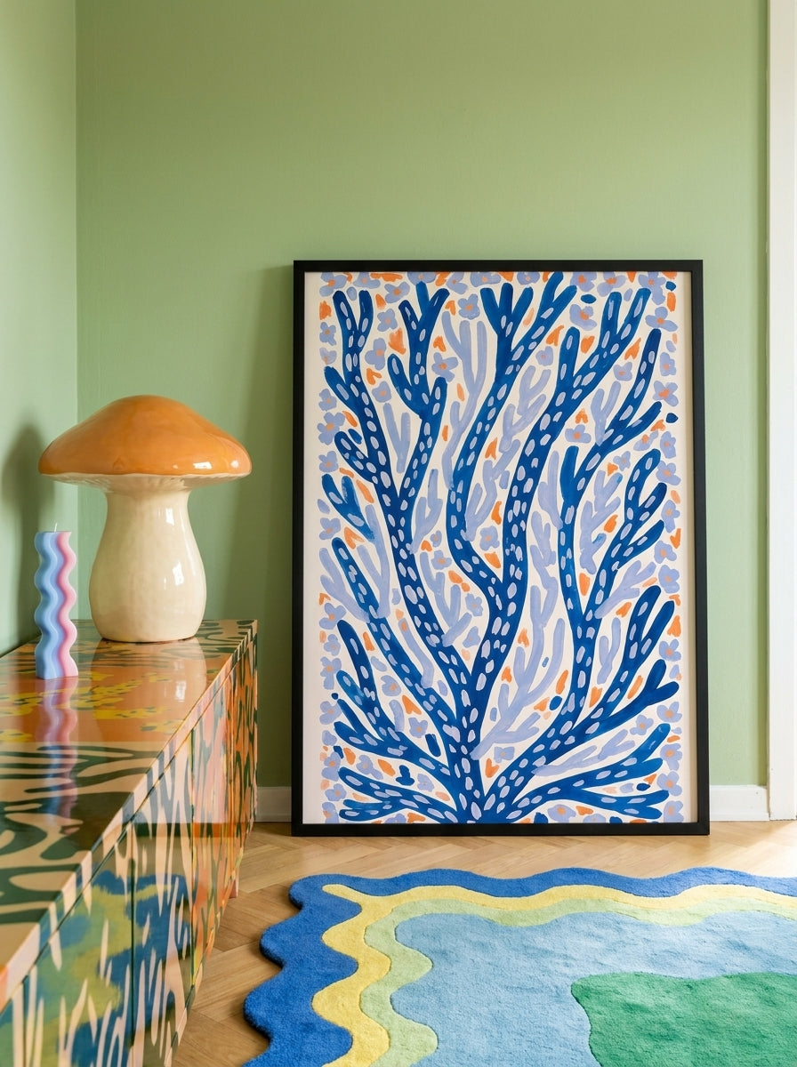 Modern wall art print standing on a sideboard in a colourful eclectic bedroom