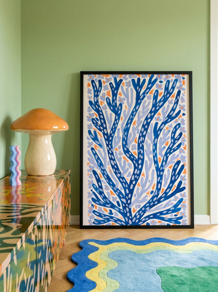 Modern wall art print standing on a sideboard in a colourful eclectic bedroom