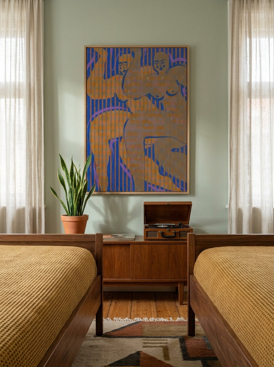 Modern wall art print styled on the wall in a mid-century bedroom