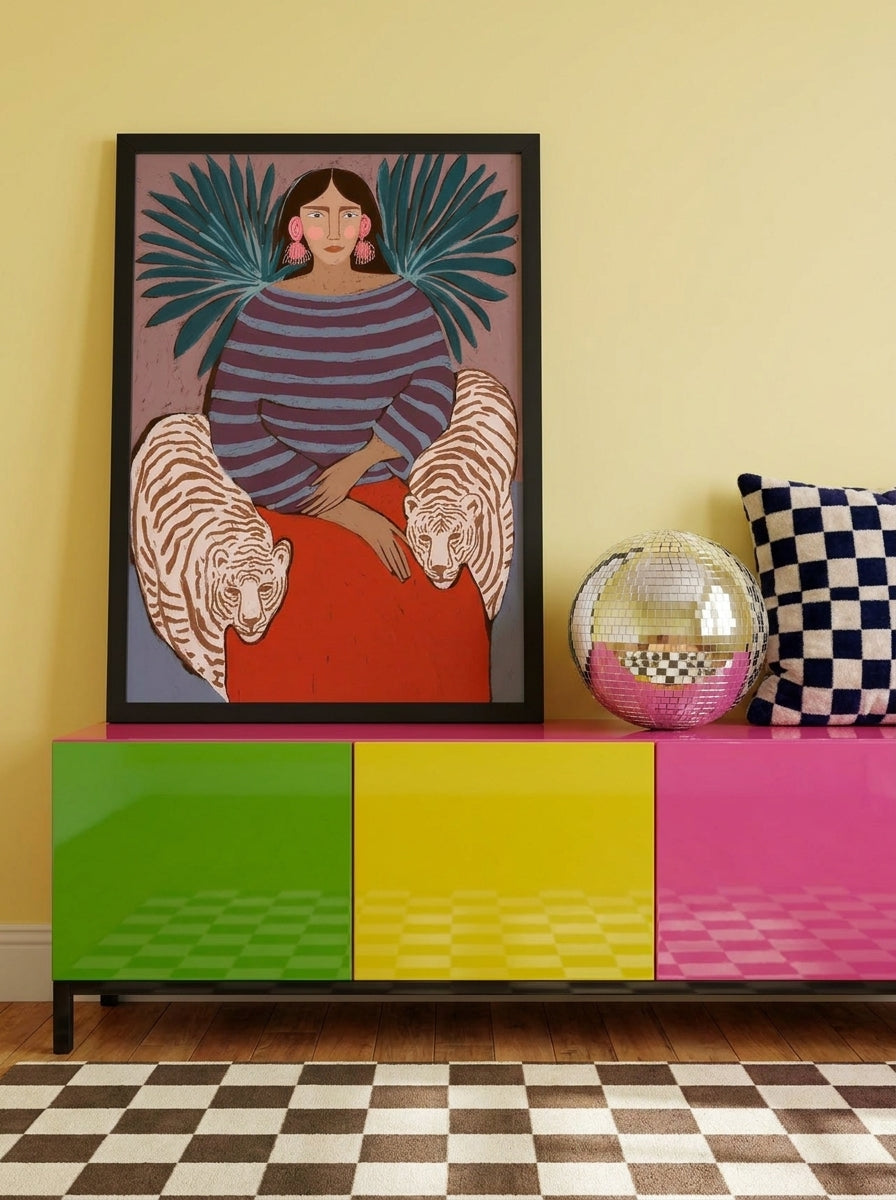 Modern wall art print standing on a sideboard in a colourful eclectic bedroom