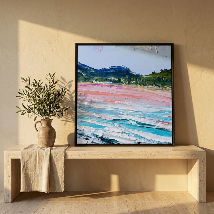 Canvas wall art with a black surround standing on a console in a Mediterranean bedroom