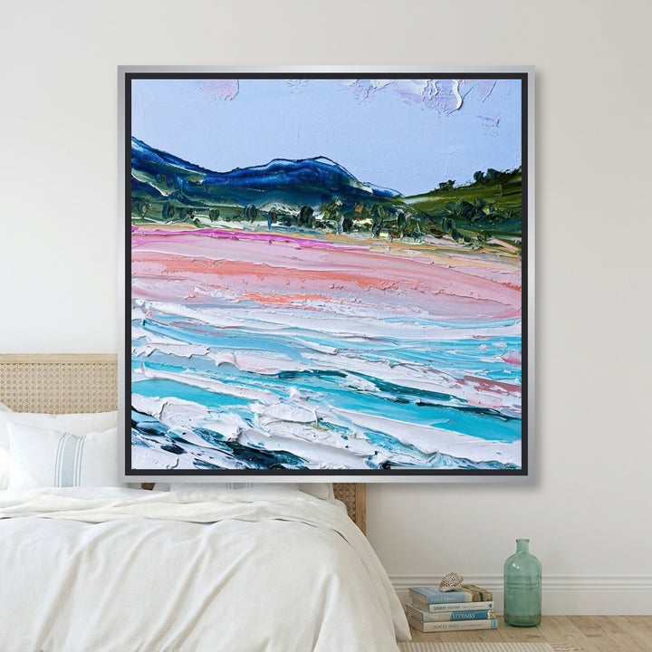 Canvas wall art with a silver leaf surround styled on the wall in a coastal bedroom