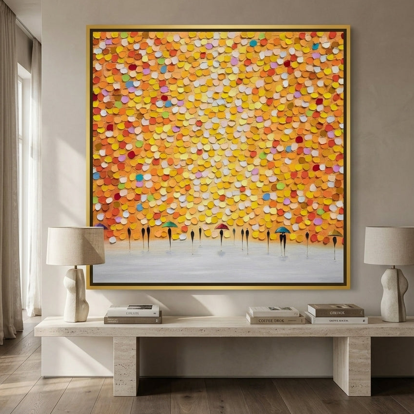 Oversized statement canvas wall art with a gold leaf surround styled on the wall in a luxe living room