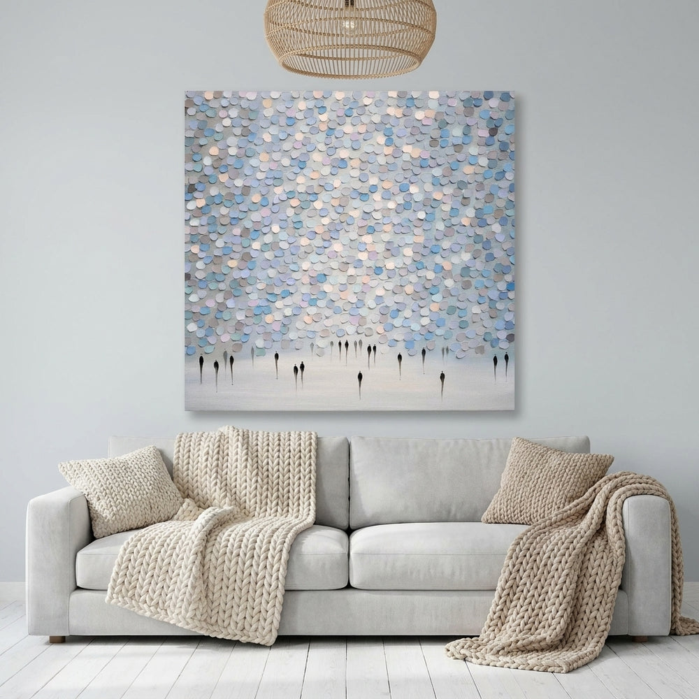 Stretched canvas wall art styled on the wall in a bright Scandinavian living room