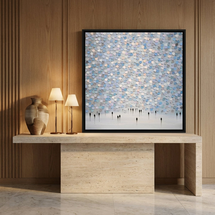 Canvas wall art with a black surround standing on a console in a luxe home office