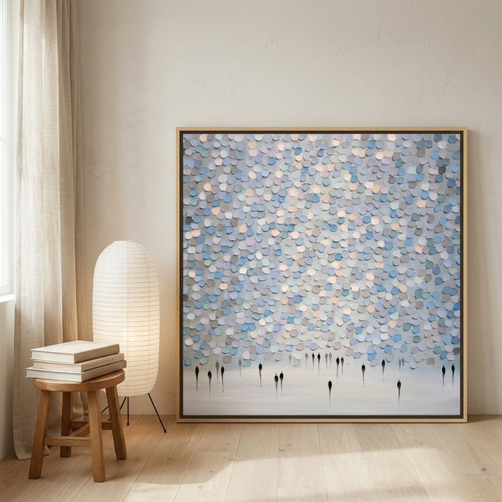 Oversized statement canvas wall art with a natural timber surround leaning against the wall in a warm Japandi bedroom