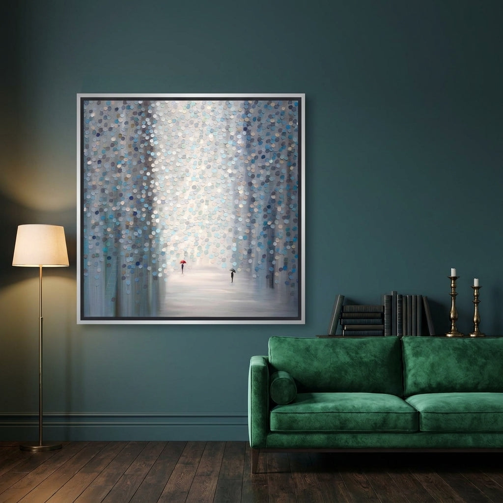 Oversized statement canvas wall art with a silver leaf surround styled on the wall in a moody living room