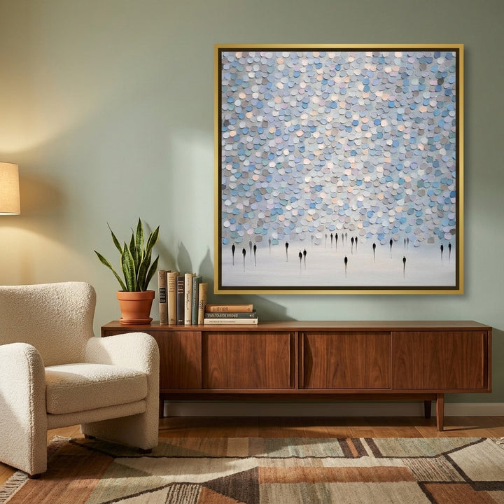 Canvas wall art with a gold leaf surround styled on the wall in a mid-century living room