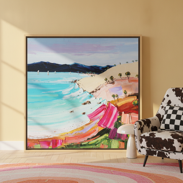 Oversized statement canvas wall art with a natural timber surround leaning against the wall in a colourful eclectic living room