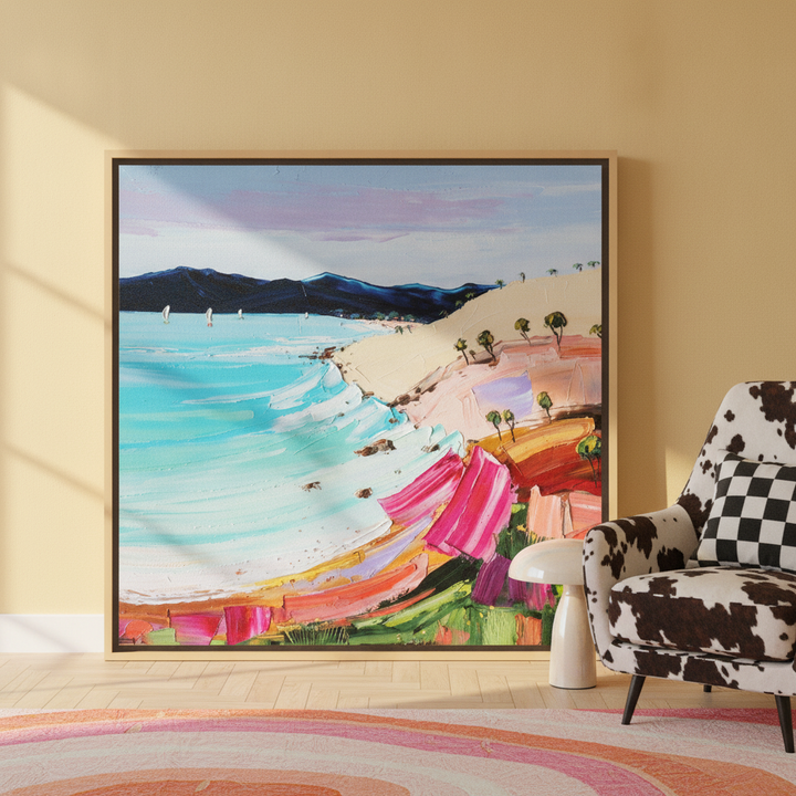 Oversized statement canvas wall art with a natural timber surround leaning against the wall in a colourful eclectic living room