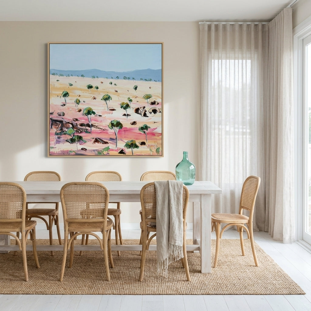 Oversized statement canvas wall art with a natural timber surround styled on the wall in a coastal dining room