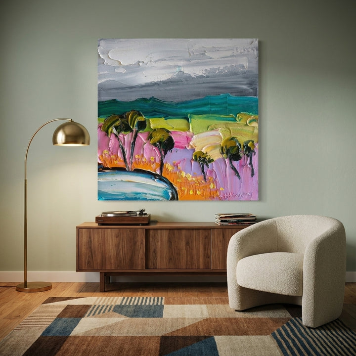 Stretched canvas wall art styled on the wall in a mid-century living room