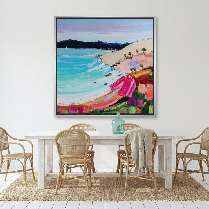 Oversized statement canvas wall art with a silver leaf surround styled on the wall in a coastal dining room