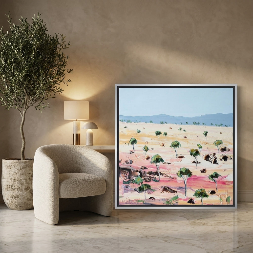 Canvas wall art with a silver leaf surround leaning against the wall in a luxe dining room