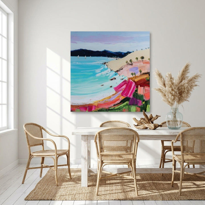 Stretched canvas wall art styled on the wall in a coastal dining room