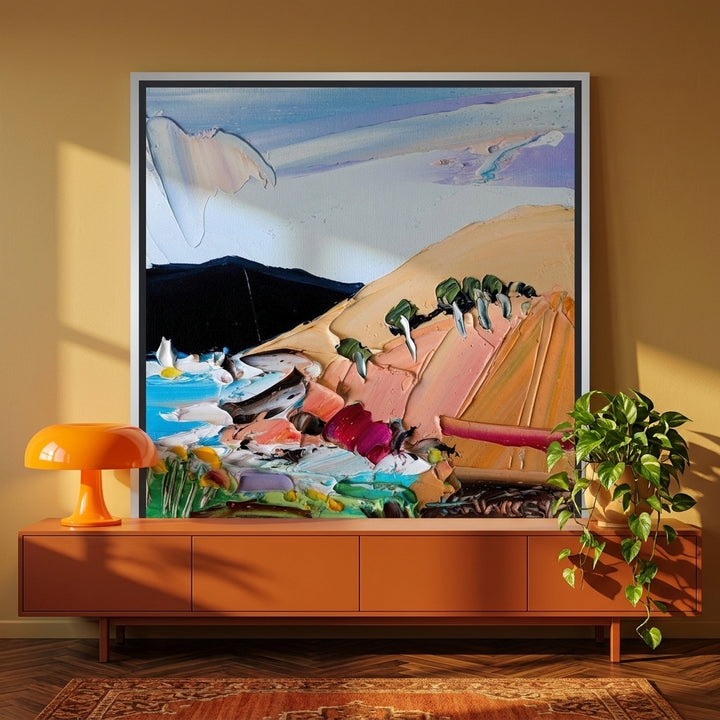 Canvas wall art with a silver leaf surround standing on a sideboard in a retro 70s living room