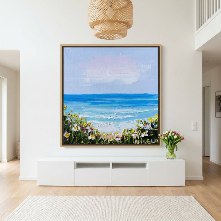 Oversized statement canvas wall art with a natural timber surround styled on the wall in a bright Scandinavian living room