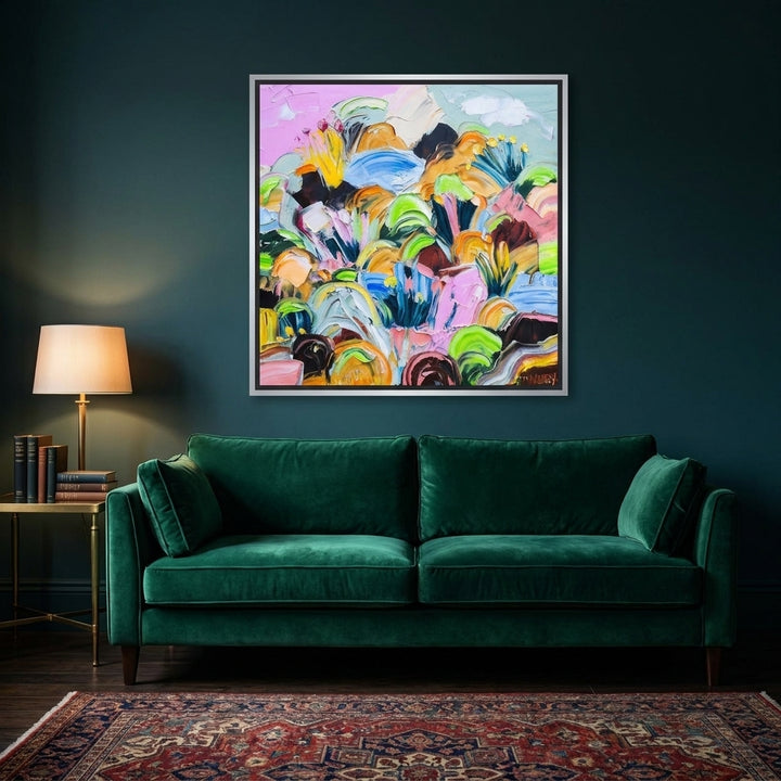 Canvas wall art with a silver leaf surround styled on the wall in a moody living room