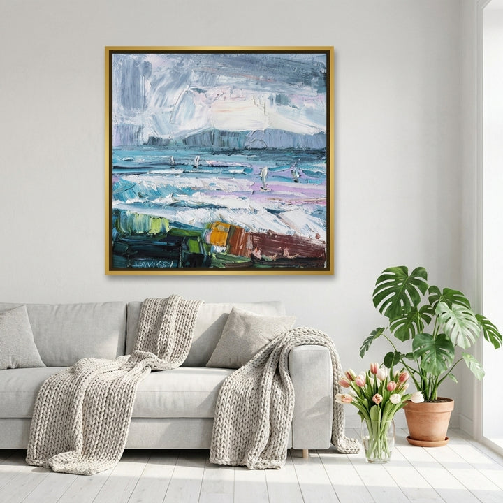 Canvas wall art with a gold leaf surround styled on the wall in a bright Scandinavian living room