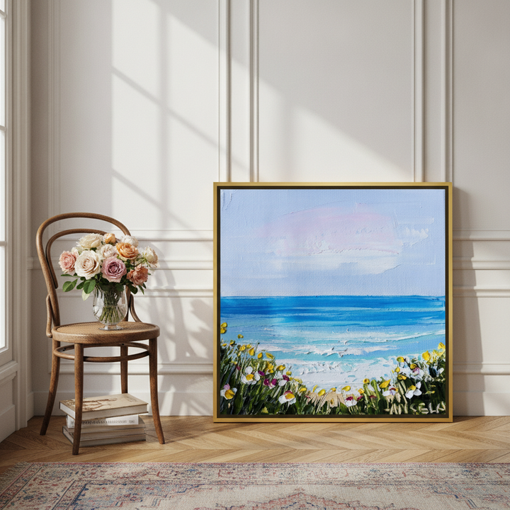 Canvas wall art with a gold leaf surround leaning against the wall in a Parisian bathroom