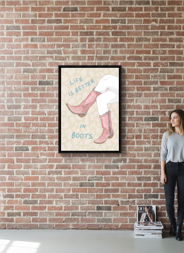 Person holding canvas wall art with a black surround in an industrial loft living room