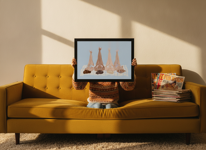 Person holding modern wall art print in a retro 70s living room