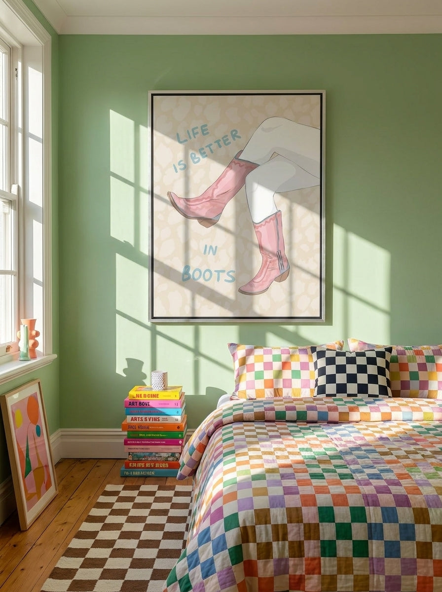 Oversized statement canvas wall art with a silver leaf surround styled on the wall in a colourful eclectic bedroom
