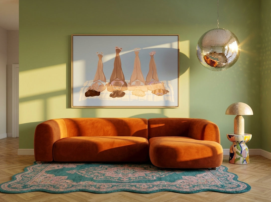 Oversized statement canvas wall art with a natural timber surround styled on the wall in a colourful eclectic living room