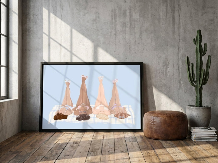 Canvas wall art with a black surround leaning against the wall in an industrial loft living room
