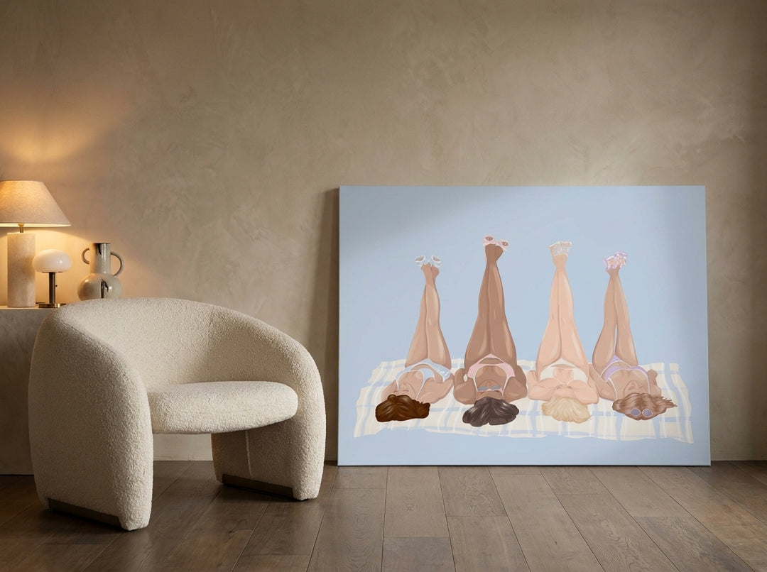 Stretched canvas wall art leaning against the wall in a luxe bathroom