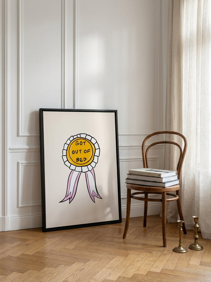 Canvas wall art with a black surround leaning against the wall in a Parisian bedroom