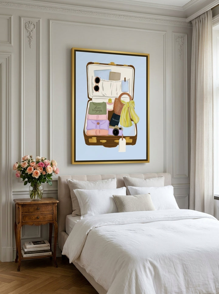 Canvas wall art with a gold leaf surround styled on the wall in a Parisian bedroom