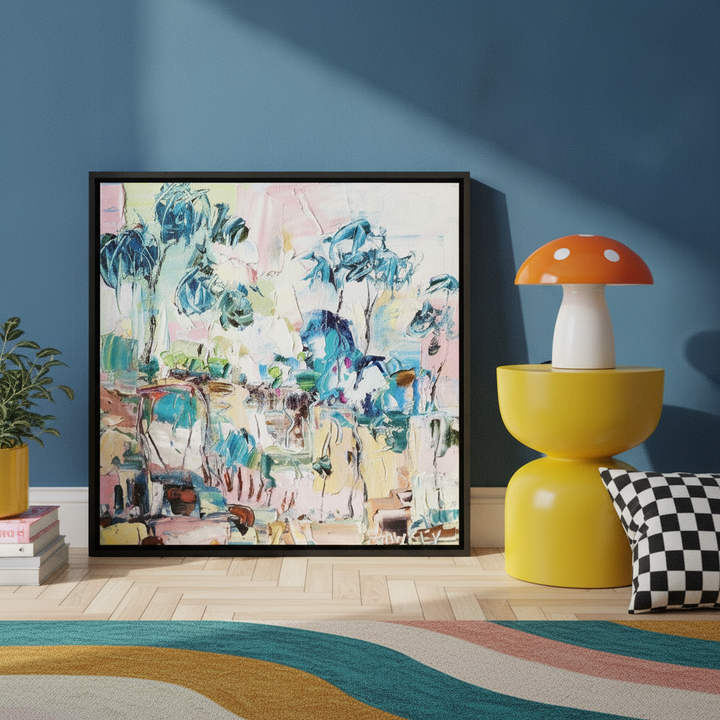 Canvas wall art with a black surround leaning against the wall in a colourful eclectic bedroom