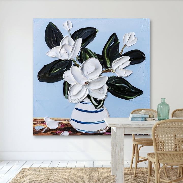Stretched canvas wall art styled on the wall in a coastal dining room