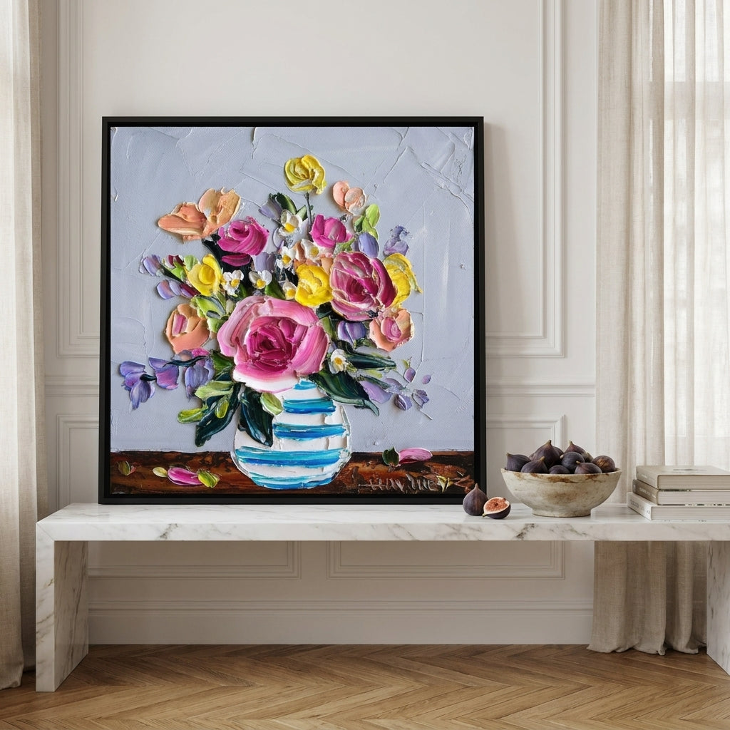Canvas wall art with a black surround standing on a kitchen bench in a Parisian kitchen