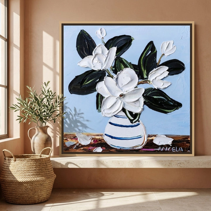 Canvas wall art with a natural timber surround standing on a kitchen bench in a Mediterranean kitchen