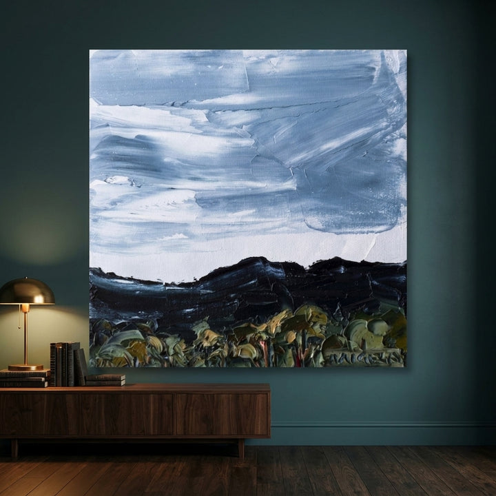 Stretched canvas wall art styled on the wall in a moody living room
