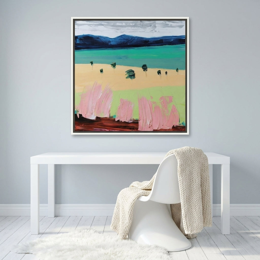 Canvas wall art with a white surround styled on the wall in a bright Scandinavian home office