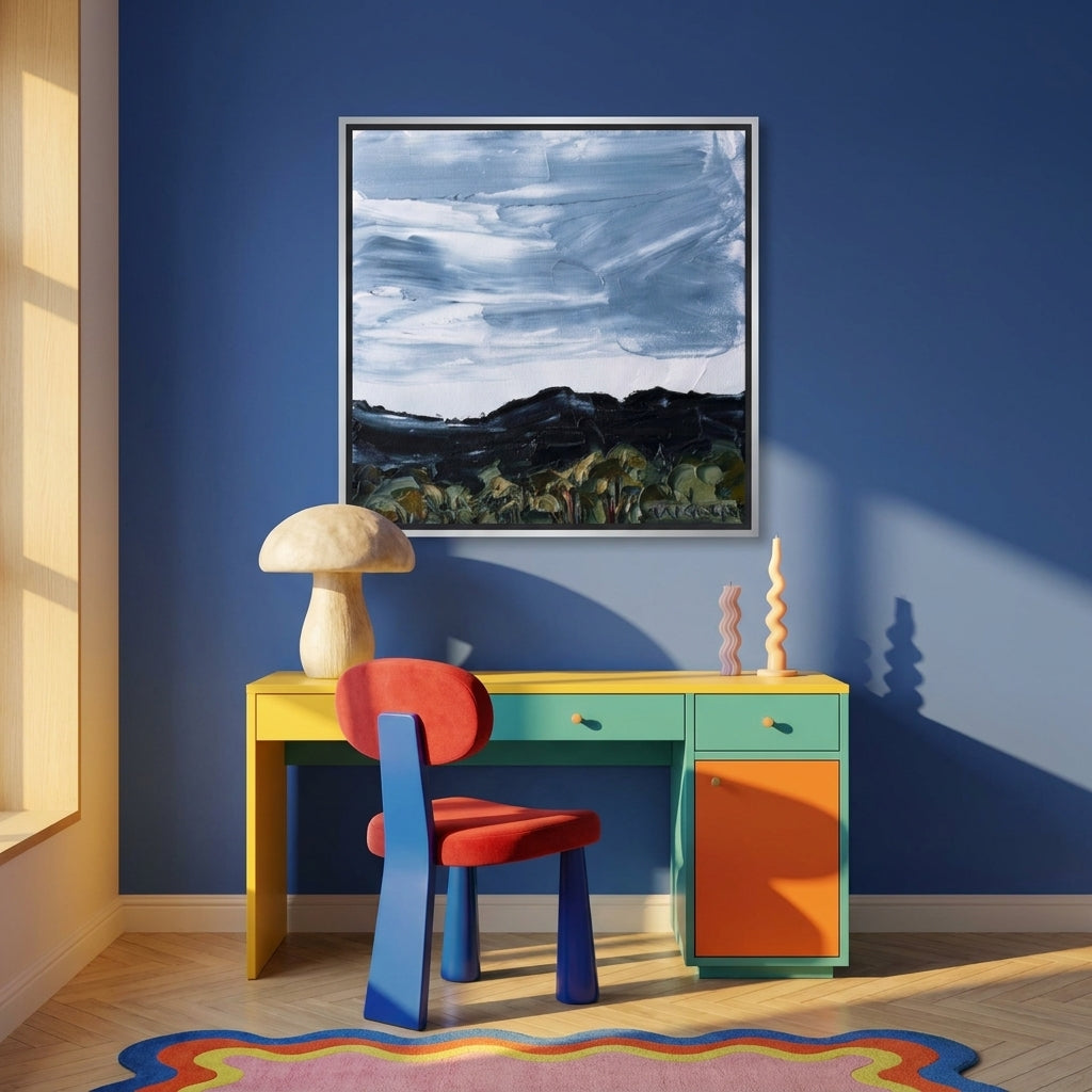 Canvas wall art with a silver leaf surround styled on the wall in a colourful eclectic home office