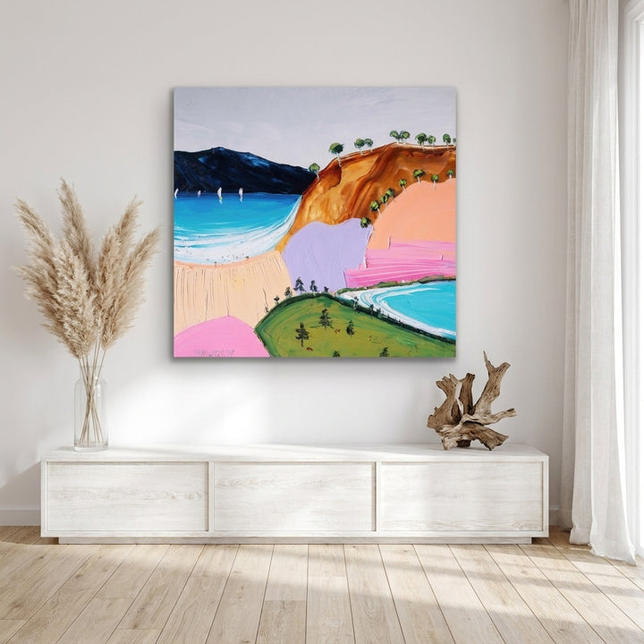 Stretched canvas wall art styled on the wall in a coastal living room