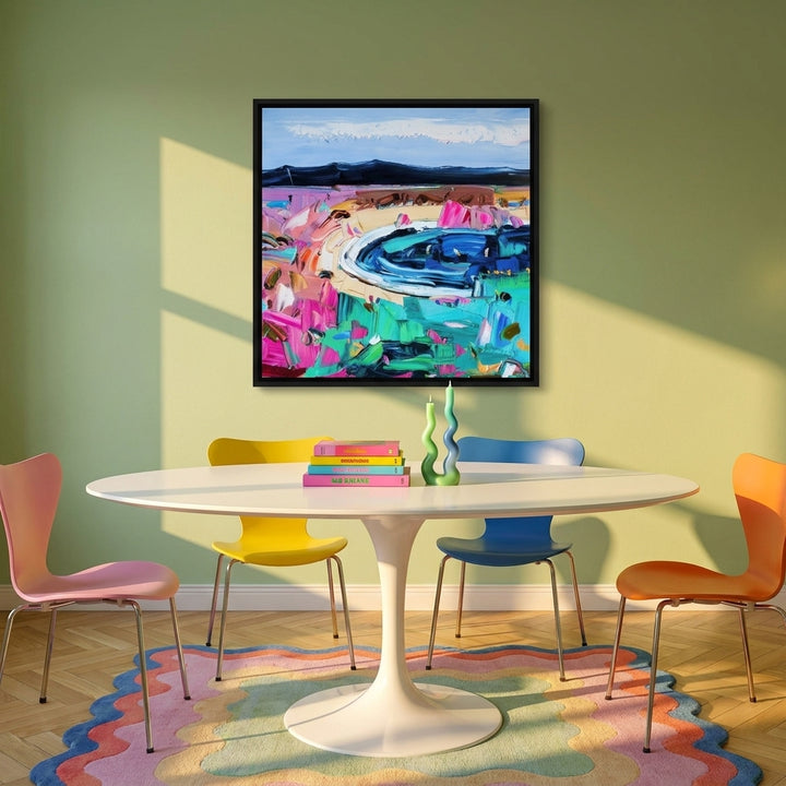 Canvas wall art with a black surround styled on the wall in a colourful eclectic dining room
