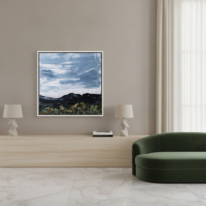 Oversized statement canvas wall art with a white surround styled on the wall in a luxe living room