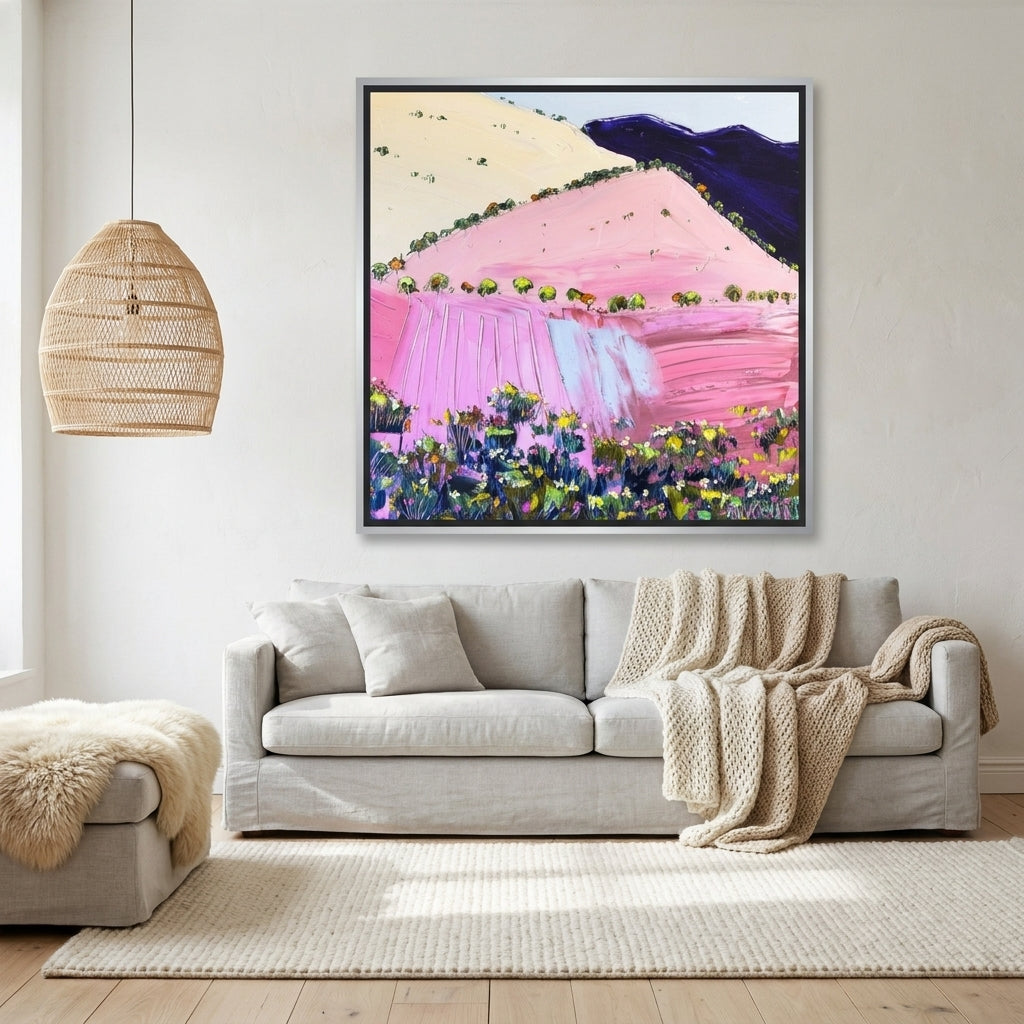 Canvas wall art with a silver leaf surround styled on the wall in a bright Scandinavian living room