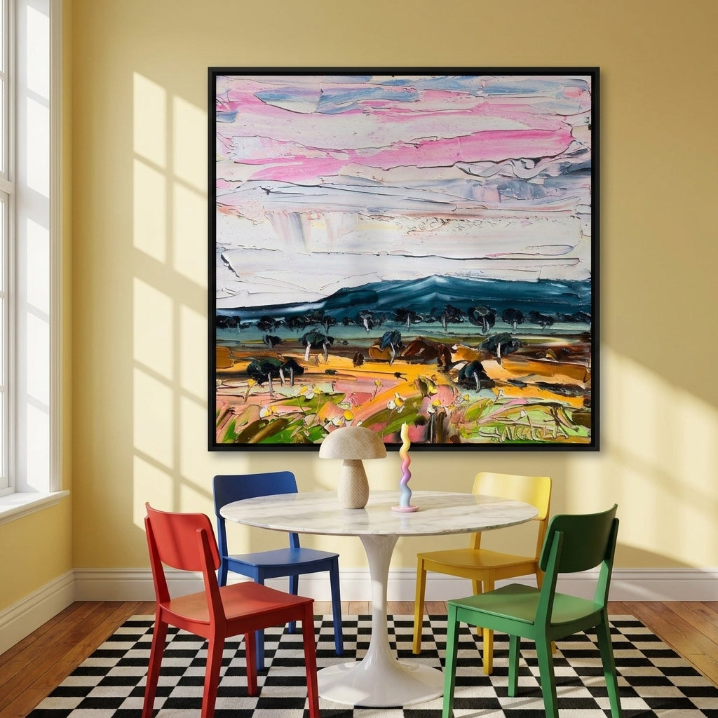 Oversized statement canvas wall art with a black surround styled on the wall in a colourful eclectic dining room