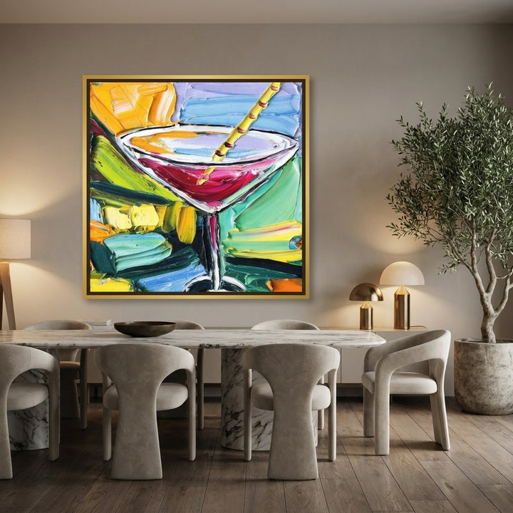 Oversized statement canvas wall art with a gold leaf surround styled on the wall in a luxe dining room